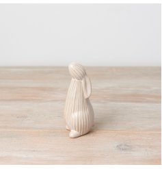 An elegant standing bunny decoration in neutral colours. Beautifully glazed and finished with a ribbed surface.