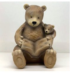 Made from a durable resin material, this ornament features Mum and cub snuggled up together reading a book.