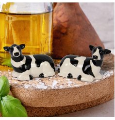 A sweet salt and pepper set detailing two sitting cows in black and white.