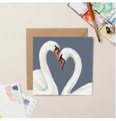A romantic greeting card featuring two swans posing to form a heart. 