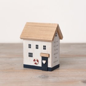 A charming 12cm wooden beach house that is perfect for adding a touch of coastal charm to any home