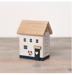 A charming 12cm wooden beach house that is perfect for adding a touch of coastal charm to any home