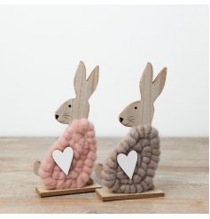 A charming assortment of two wooden bunny ornaments