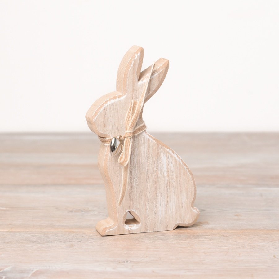 A charming wooden bunny ornament with a rustic natural bow and silver heart charm. 