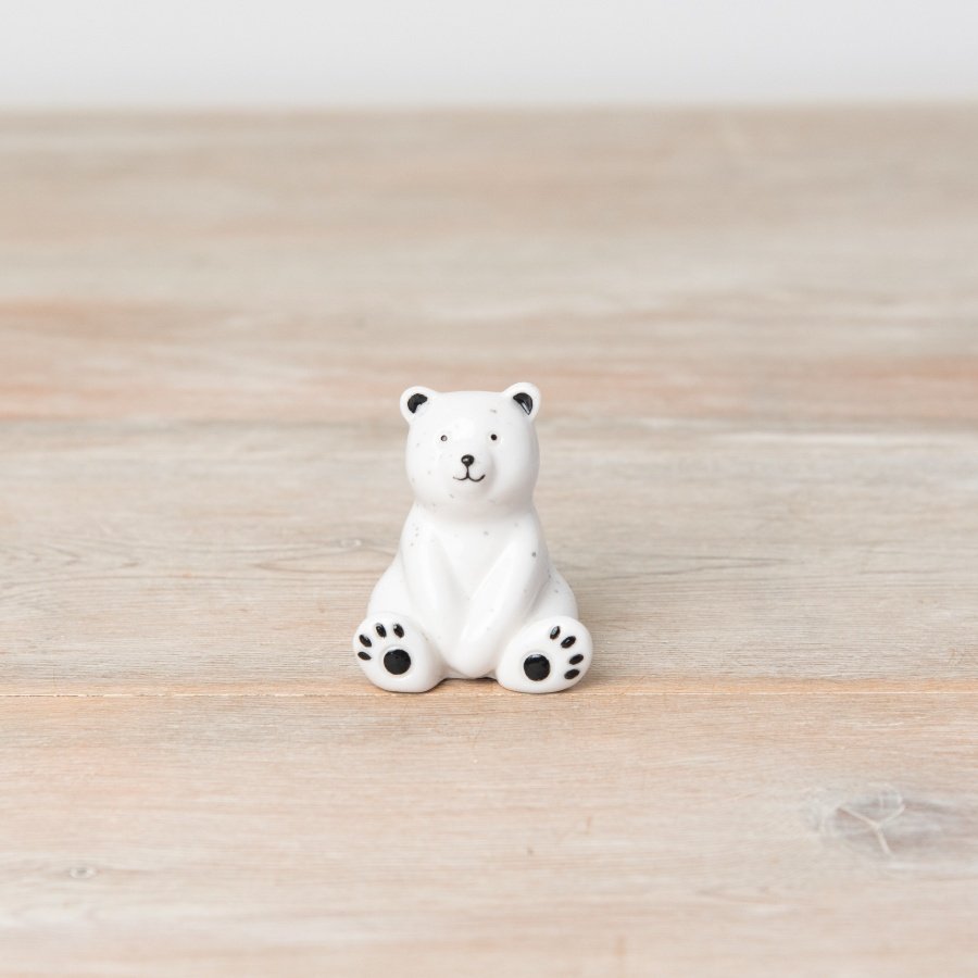 Fall in love with this adorable porcelain bear ornament. With a cute painted face and speckled finish. 