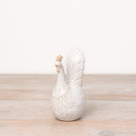 Add texture and country charm to the home with this natural chicken ornament.