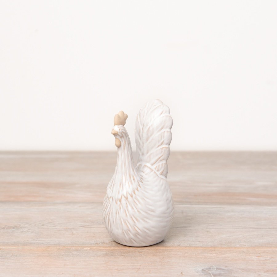 A charming country chicken ornament with ribbed detailing and a natural two tone glaze.