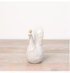 A country living style chicken ornament with a natural two-tone glaze.