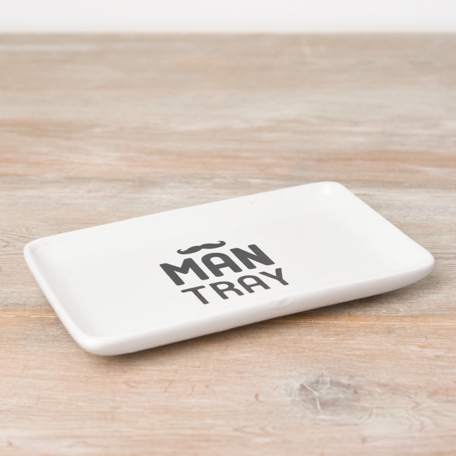 Stay organised with this stylish and contemporary ceramic dish with 'MAN TRAY' slogan.