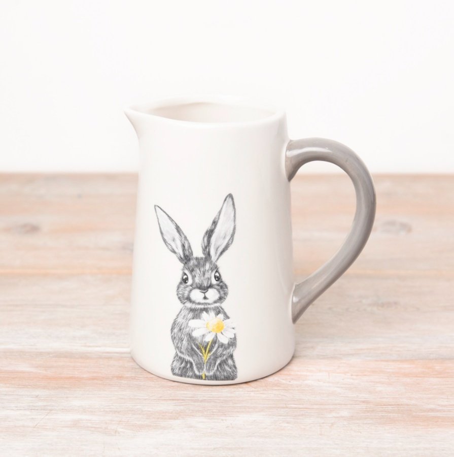 A decorative jug with a Hare design complete with a grey handle. 