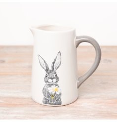 An enchanting Spring jug adorned with a charming rabbit design holding a daisy.