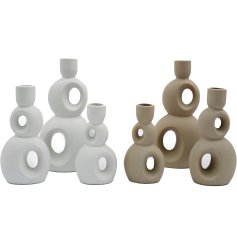 This set of 3 abstract Taper Candle Holders is the perfect way to add a modern touch to the home.