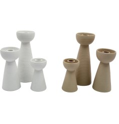 This set of 3 ribbed taper candleholders adds a chic and modern touch to any home.