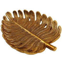 A gold leaf shaped trinket plate.