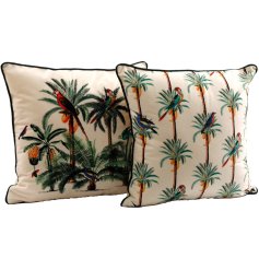 2 assorted cushions with vibrant illustrations of palm trees and parrots