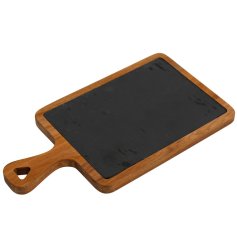 A delightful wooden serving board with a slate top, a perfect way to display and serve dishes on those special occasions