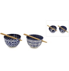An assortment of two stylish bowls with a set of chopsticks. 