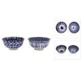 An assortment of 2 blue stoneware bowls with an on trend tye dye pattern