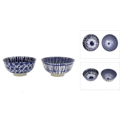 An assortment of 2 blue stoneware bowls with an on trend tye dye pattern