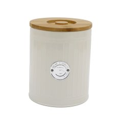 A luxury cream biscuit tin with ribbed detailing and a wooden lid. 