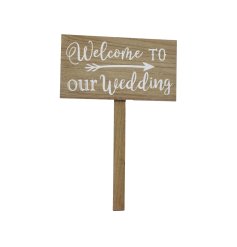 A shabby chic wooden sign which reads ' Welcome to our Wedding' in white font. 