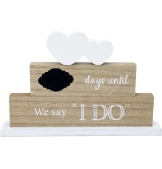 A wedding countdown plaque with a black bubble for writing down the numbers each day. 