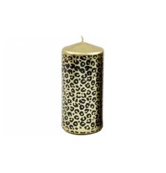 A chunky leopard printed pillar candle in gold and black. 