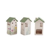 A colourful and unique house shaped t-light holder with a sage green roof and wild flower motif. 