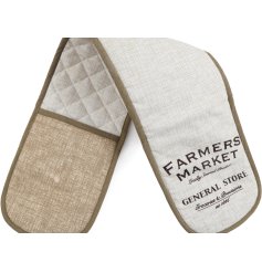 A rustic oven glove in a neutral colour tone with scripted text. 