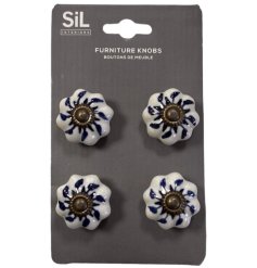 A vintage set of 4 cream drawer knobs with unique patterns.