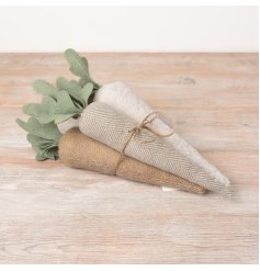 A gorgeous bundle of fabric carrot decorations in an assortment of fabrics and neutral colours.
