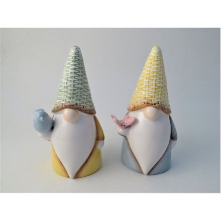 An assortment of 2 glazed gonk ornaments wearing simplistic outfits and a woven style hat. 