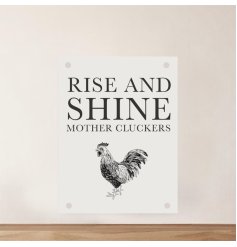 A farmhouse metal sign with the quote 'Rise & Shine Mother Cluckers' and a rooster illustration. 