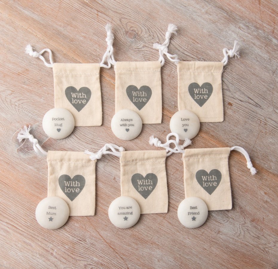 A mix of 6 smooth pebble style sentiment slogans, each with an individual printed cotton gift bag. 