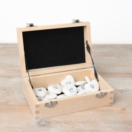 An assortment of 40 mini heart pebbles each with a short quote and illustration, supplied in a wooden storage box. 