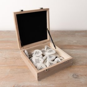 A mixed box of natural heart shaped key chains, each with a sentimental and motivational slogan. 