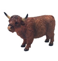 A strong highland cow ornament in brown. It details coarse fur and has a pair of proud horns. 