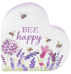 A heart shaped plaque with the quote 'bee happy' in purple, detailing 2D and 3D images of flowers and bees. 