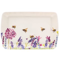 A pretty design of flowers and bees on a small tray. 