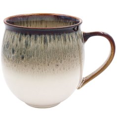 Enhance your kitchenware collection with this exquisite mug featuring a captivating reactive glaze.
