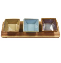 This set of three snack dishes placed on a wooden tray is the perfect way to serve up snacks and nibbles in style.