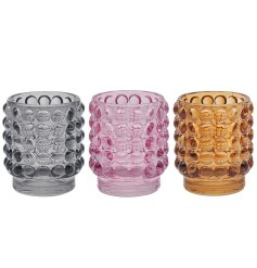 3 assorted small candle holders in a bubble embossed pattern.