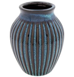 A small wide vase with a ribbed detail and a reactive glaze finish. 