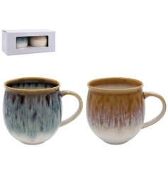 A set of 2 wide round mugs with a reactive glaze effect in a gift box. 