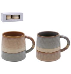 A set of 2 mugs in a two tone effect and a reactive glazed finish. 