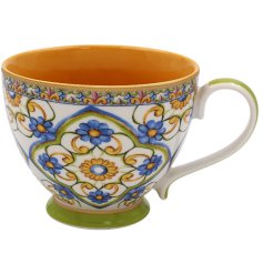 A gorgeous mug bursting with colour. Detailing floral patterns and a green base