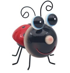 A metal ladybird ornament full of bright colours and big gazing eyes.