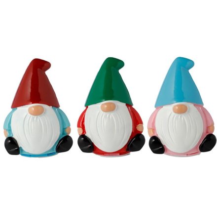3 assorted Christmas gnome lip balms, each wearing tall hats and chunky black boots.