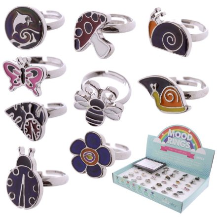 An assortment of 9 mood rings each with an image on the front and an extendable back piece.