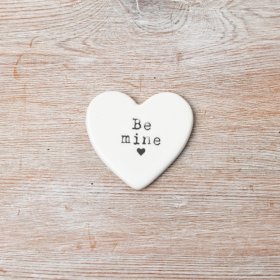 A charming heart trinket featuring the phrase 'Be Mine' at its center.